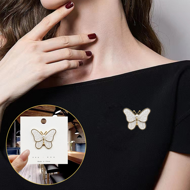 High-grade white butterfly brooch alloy dripping Pearl anti-exposure pin corsage factory clothing accessories