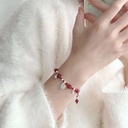 Miao Jiang girl ~ hand-woven wine red rope Lucky Bell bracelet Chinese style national style niche design hand rope